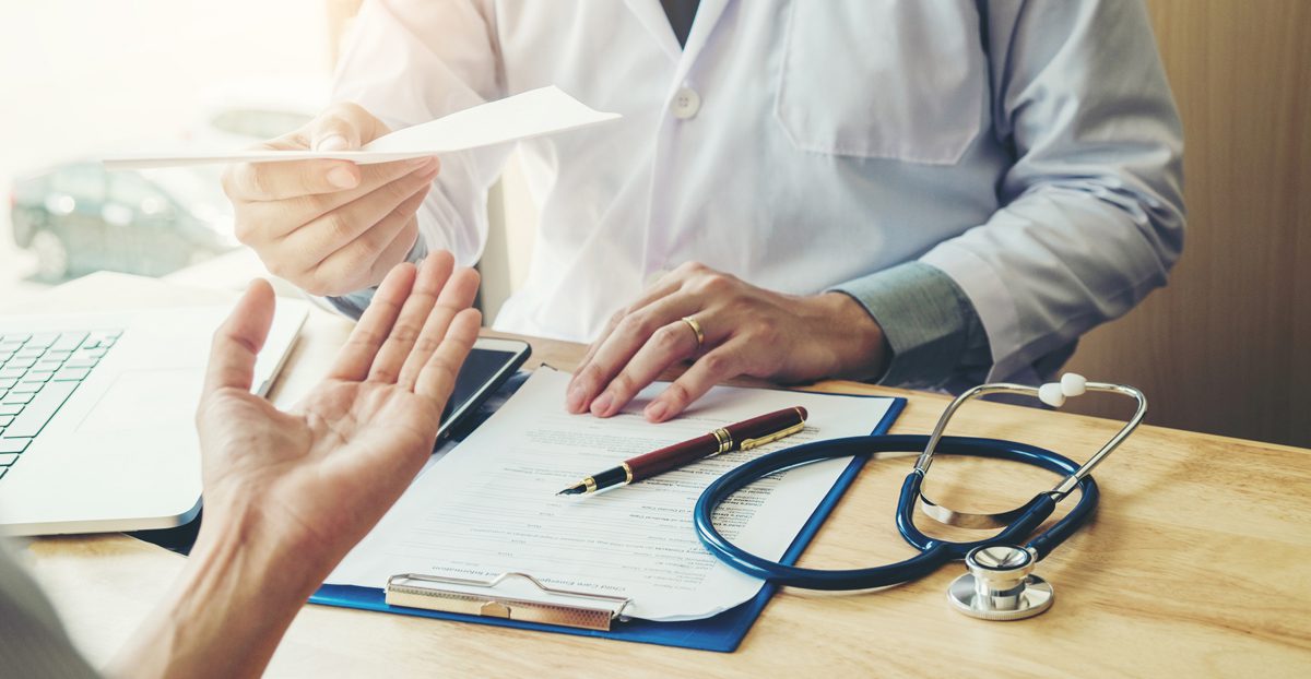 Doctor-giving-a-medical-prescription-to-patient Doctor-giving-a-medical-prescription-to-patient