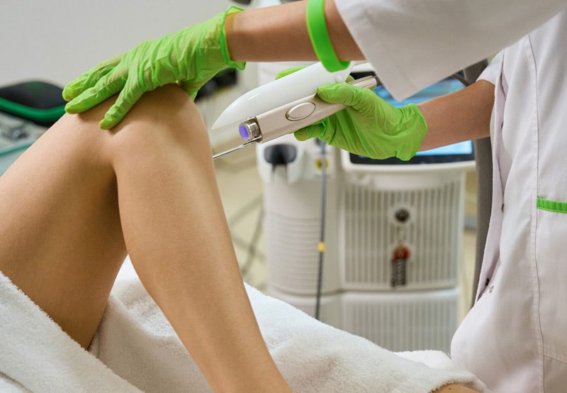 Doctor-performing-a-vaginal-wall-rejuvenation-procedure-on-a-patient
