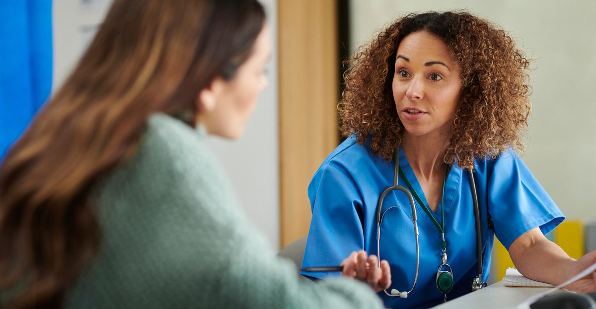 Mature-woman-discussing-treatment-options-with-her-doctor
