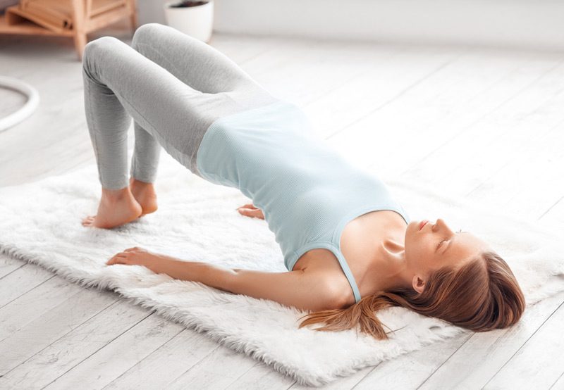 Woman-performing-pelvic-floor-physical-therapy-exercise