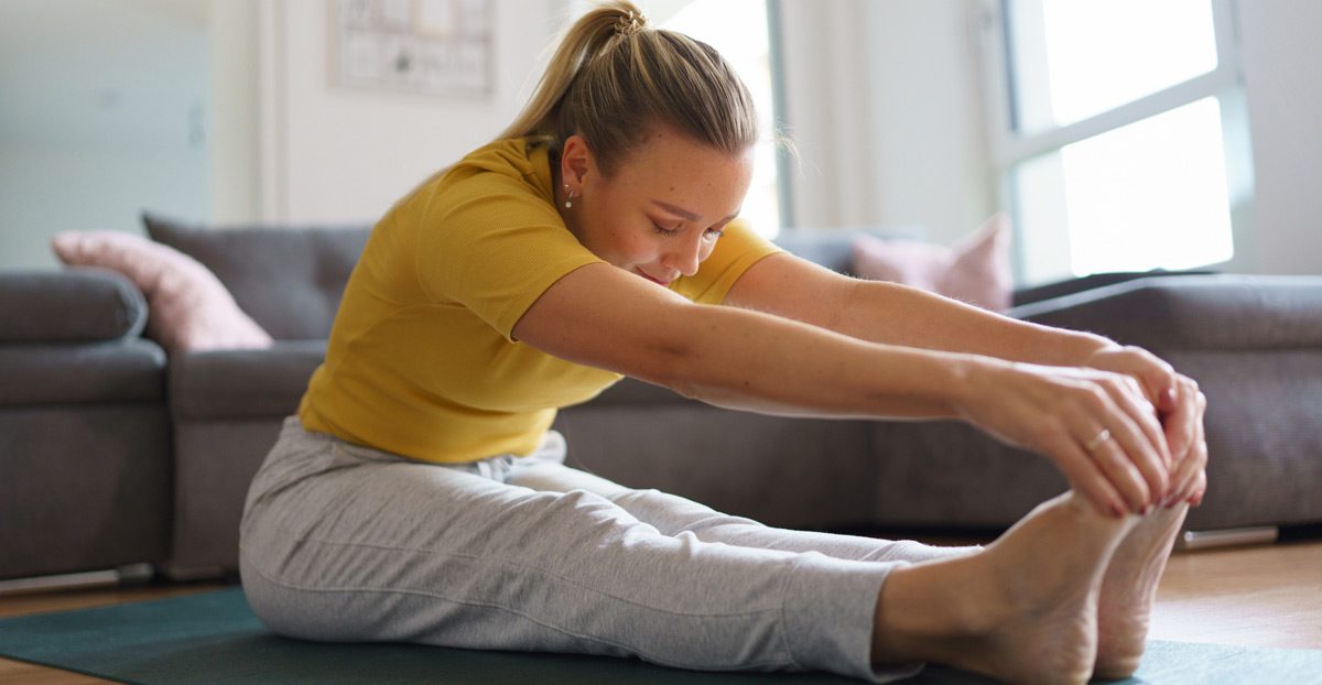 Woman-stretching-at-home Woman-stretching-at-home