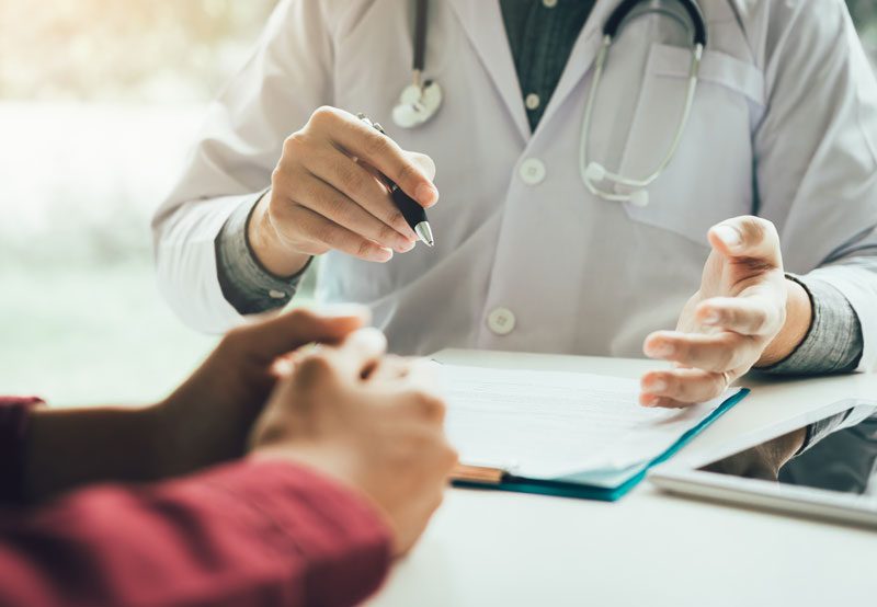 Doctor-consulting-mature-woman-about-menopause-treatment-options