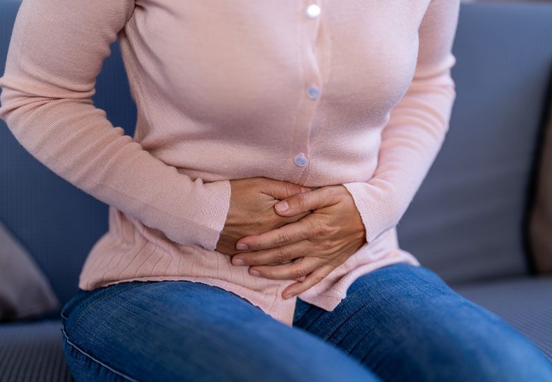 Woman-experiencing-abdominal-pain