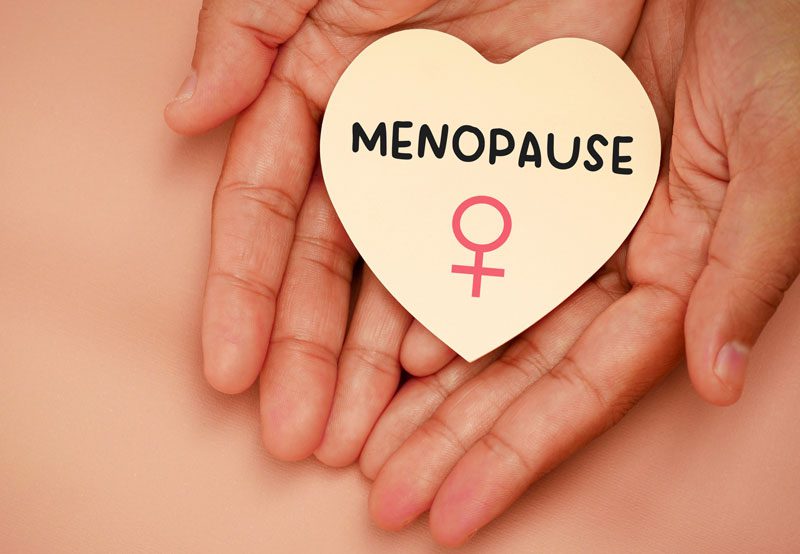 Woman-with-a-heart-shaped-menopause-awareness-card