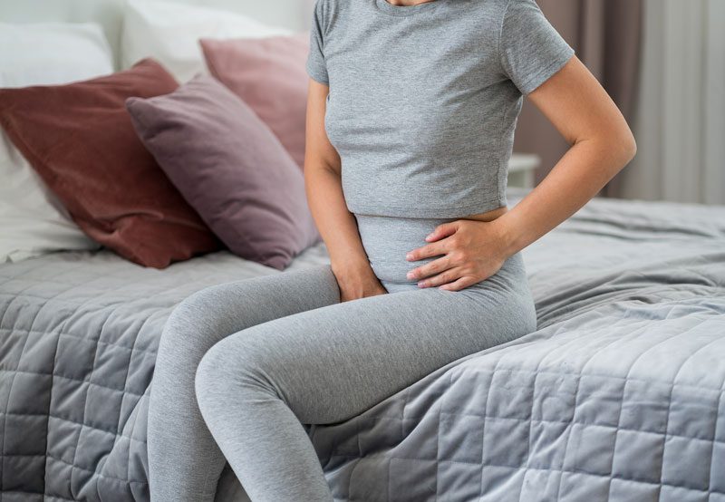 Young-woman-experiencing-menstrual-cramps Young-woman-experiencing-menstrual-cramps